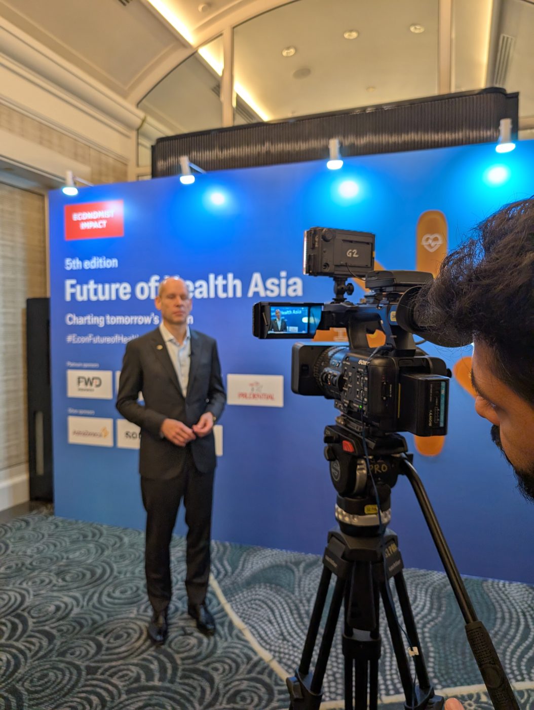 Rigging and lighting truss being prepared backstage at Future of Health Asia 2025